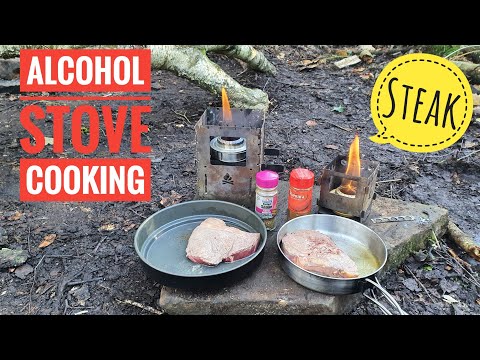 cooking steak on two different alcohol stove In the woodland, Bush box stoves,