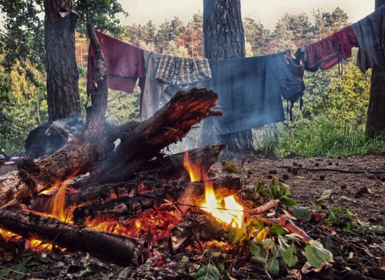 washed-clothes drying by campfire