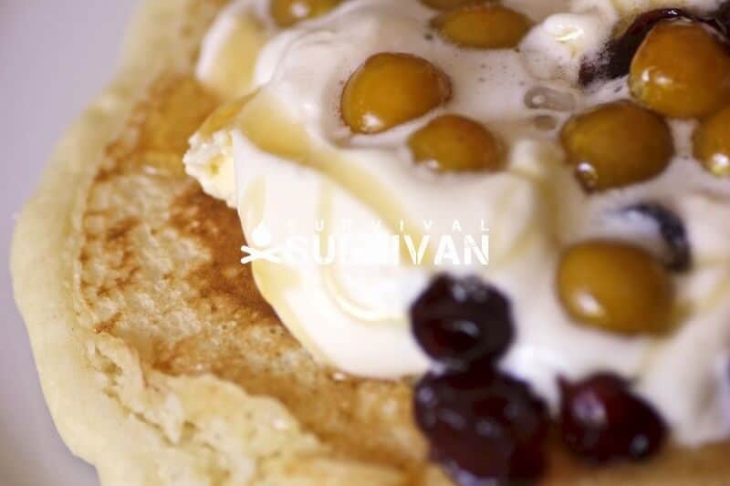 Cornmeal pancake with honey cream and berries