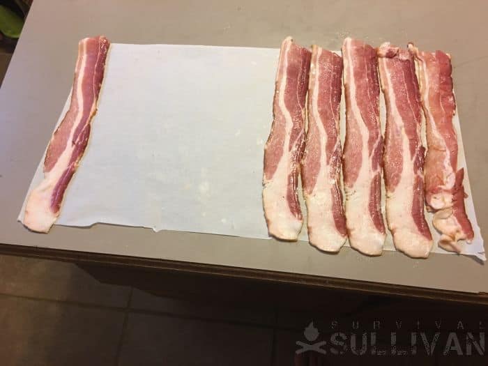 laying bacon strips on paper