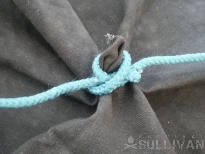constrictor knot securing a tarp hole