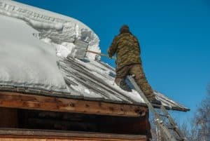 removing snow from roof in siberia