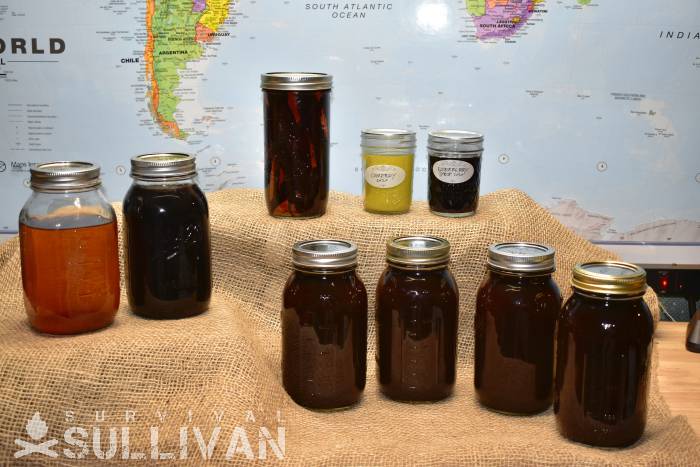 vanilla comfrey salve elderberry syrup and tinctures in glass jars