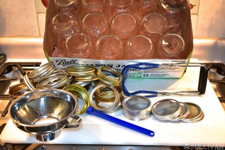 Canning Tools. Left to Right: Funnel, Rings, Pint Jars, Jar lifter, Magnetic Lid Lifter, Lids