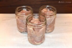 pint jars of diced chicken, ready for salt and the canner