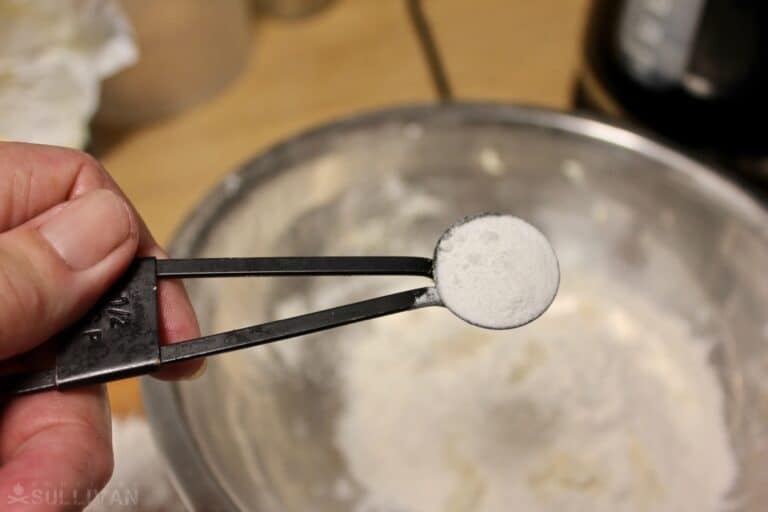 measuring out the baking soda to add to the last of the milk