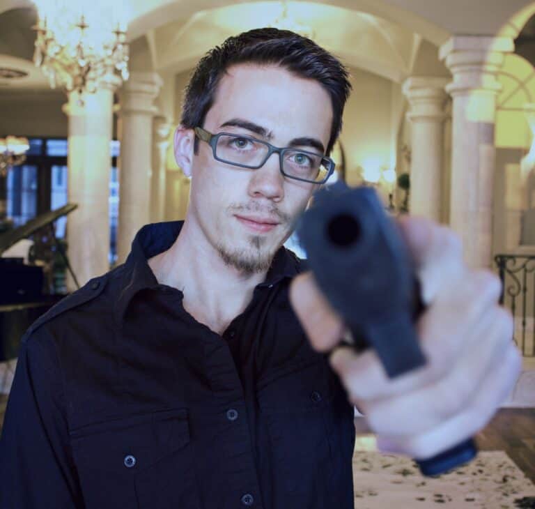 man threatening with a handgun