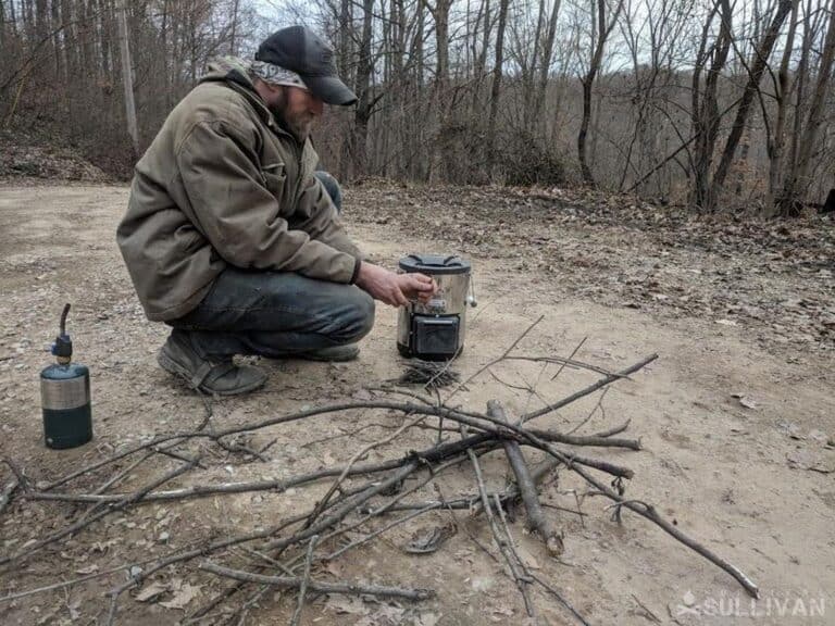 using a portable rocket stove in the woods
