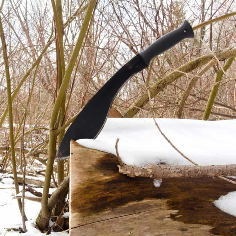 kukri knife stuck in log