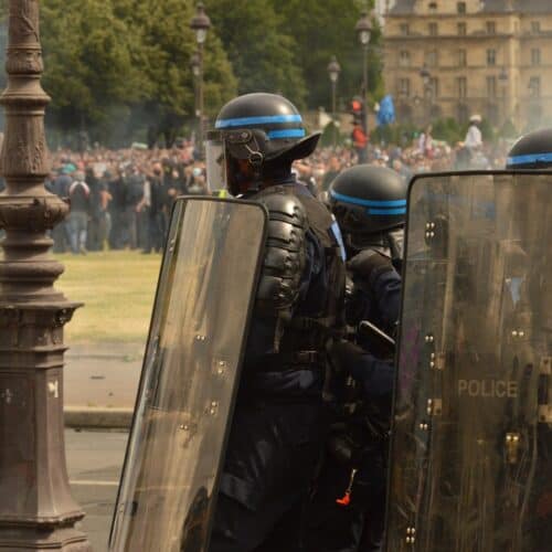 police shield during riot