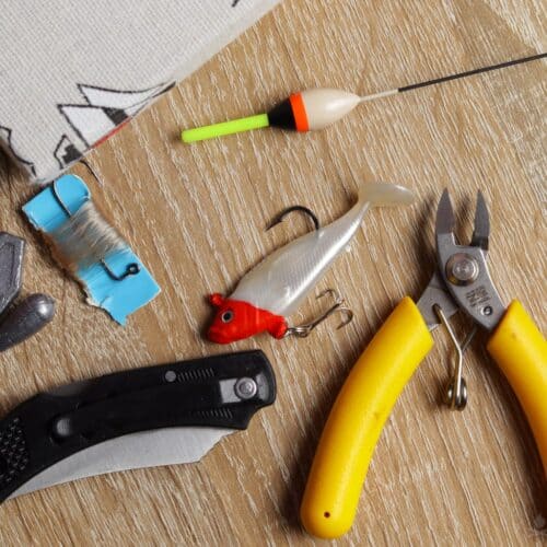 basic fishing gear: fishing rod, hooks, float, lure, sinkers, folding knife, and fishing pliers