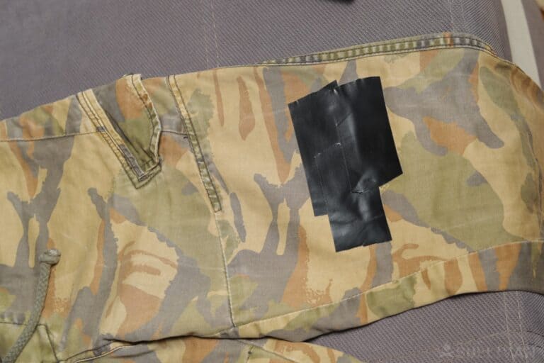 camo pants patched with duct tape