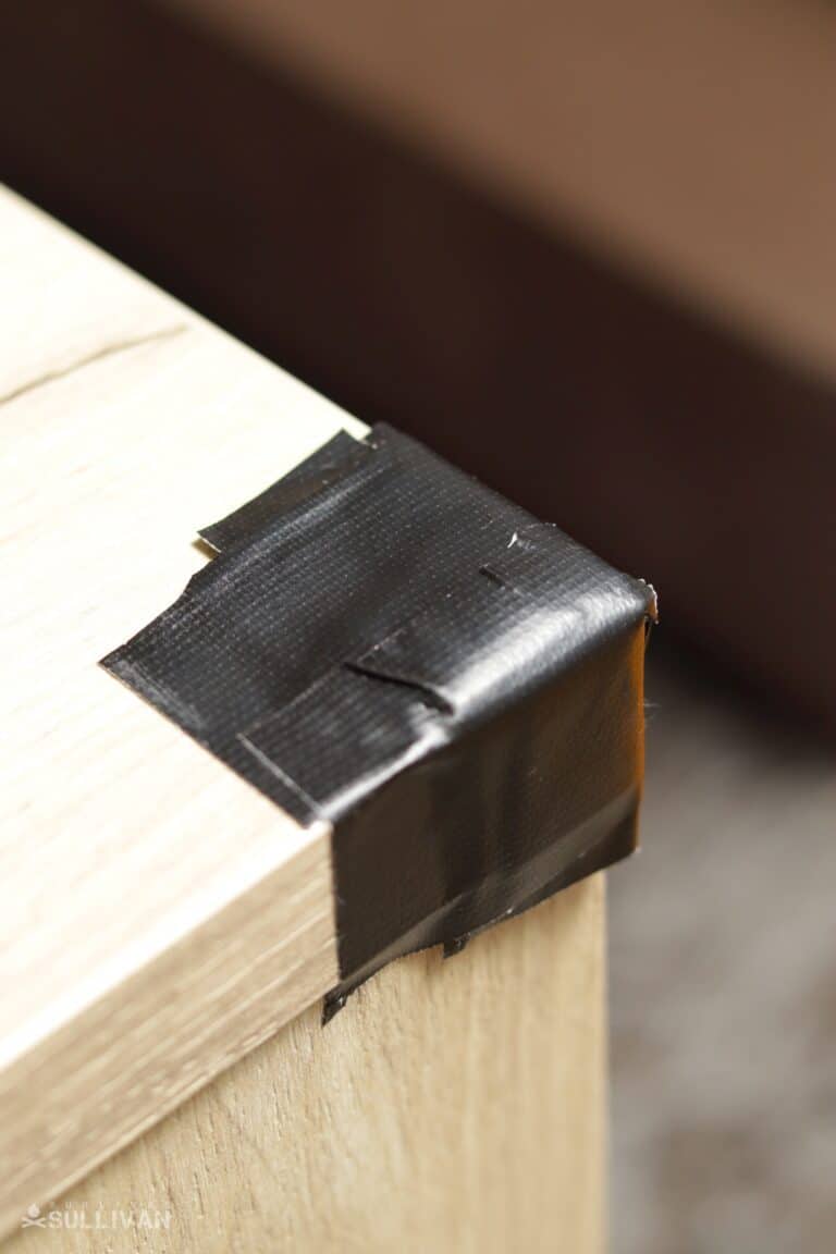 corner of wooden table taped with duct tape