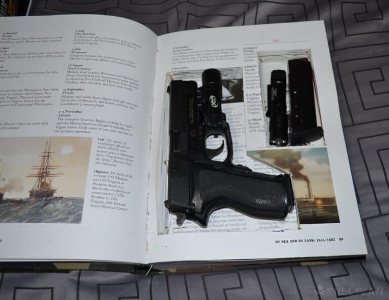 hidden gun inside open book (book safe)