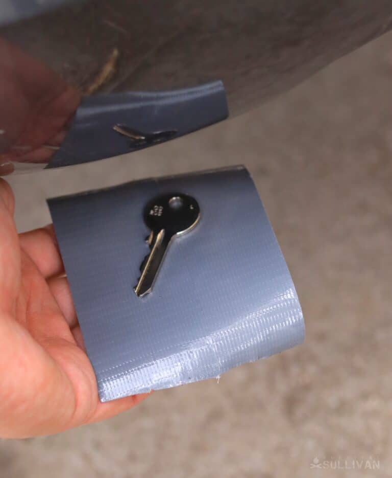 hiding key under car with duct tape