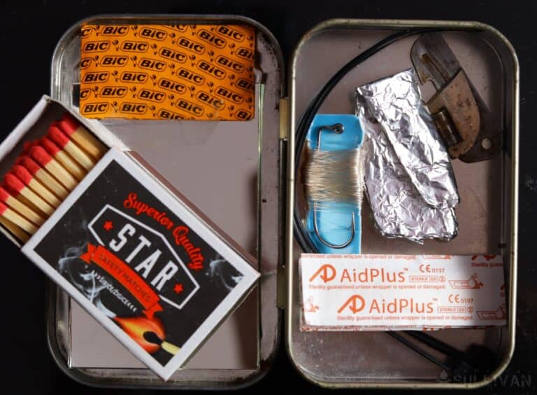 matches razor fishing hook and rod and multi-tool inside Altoids tin