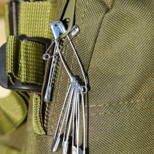 safety pins attached to backpack