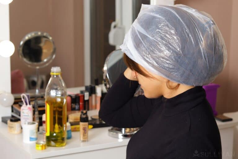 woman using cooking oil as hair conditioner