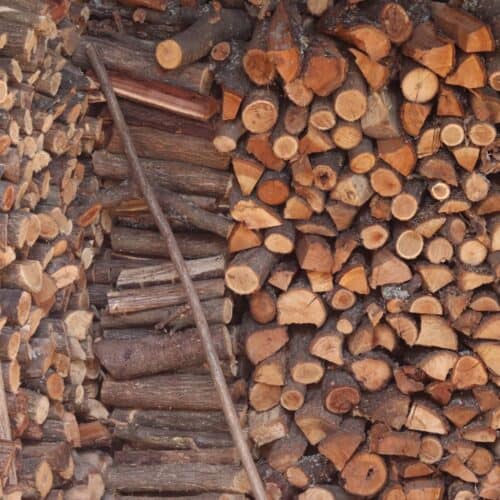 oak, plum, and acacia stacked wood stockpile