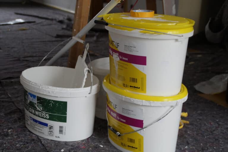 three paint buckets