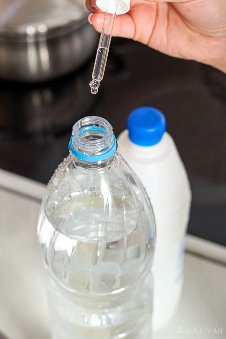 adding bleach in a water bottle