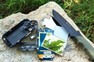 smartphone taken apart next to knife
