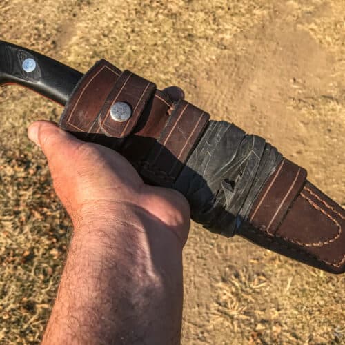 catapult wrapped around the sheath of fixed-blade knife
