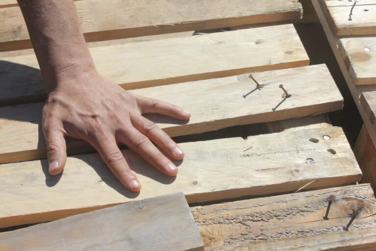 carpenter setting up a plank