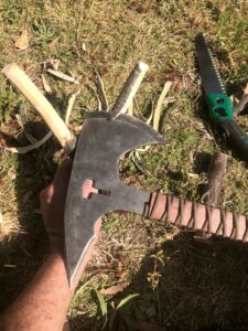cleaning up Y-shaped branch with tomahawk