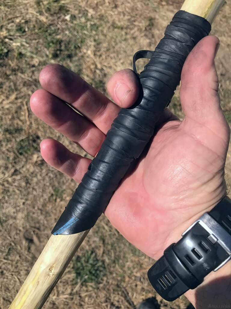 grip wrap on spear in hand