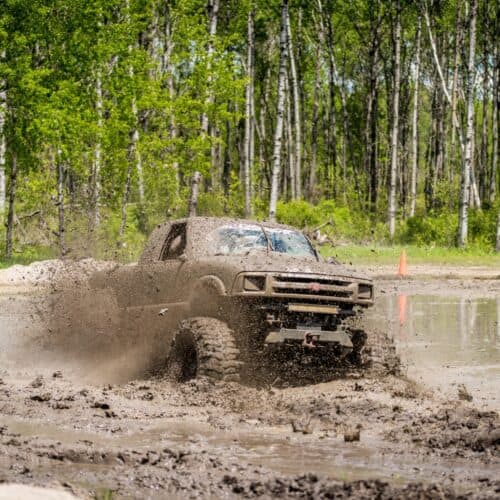 a muddy 4x4 Chevy vehicle