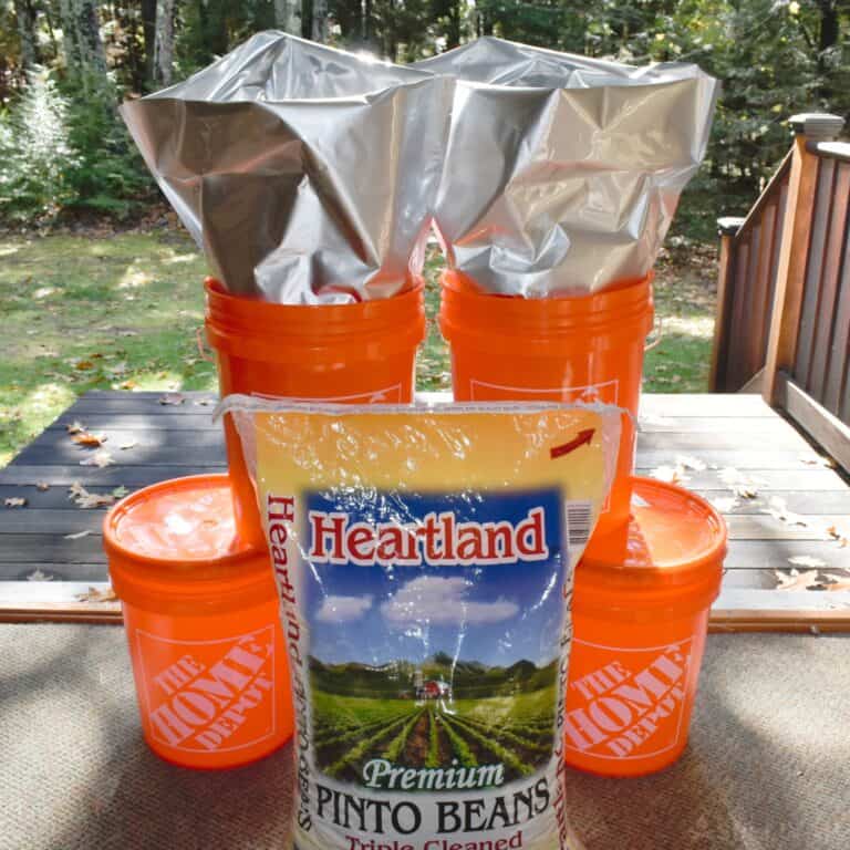pinto beans and 5 gallon buckets ready to be sealed