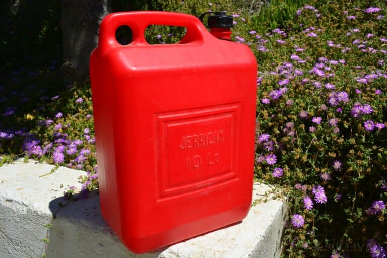 a red 10 liter Jerry petrol can