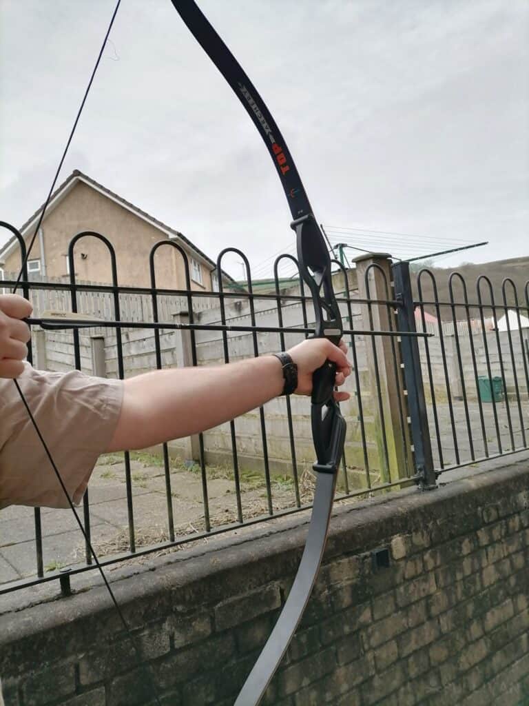 aiming a bow and arrow