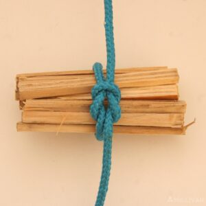 some pieces of wood tied with a reef knot