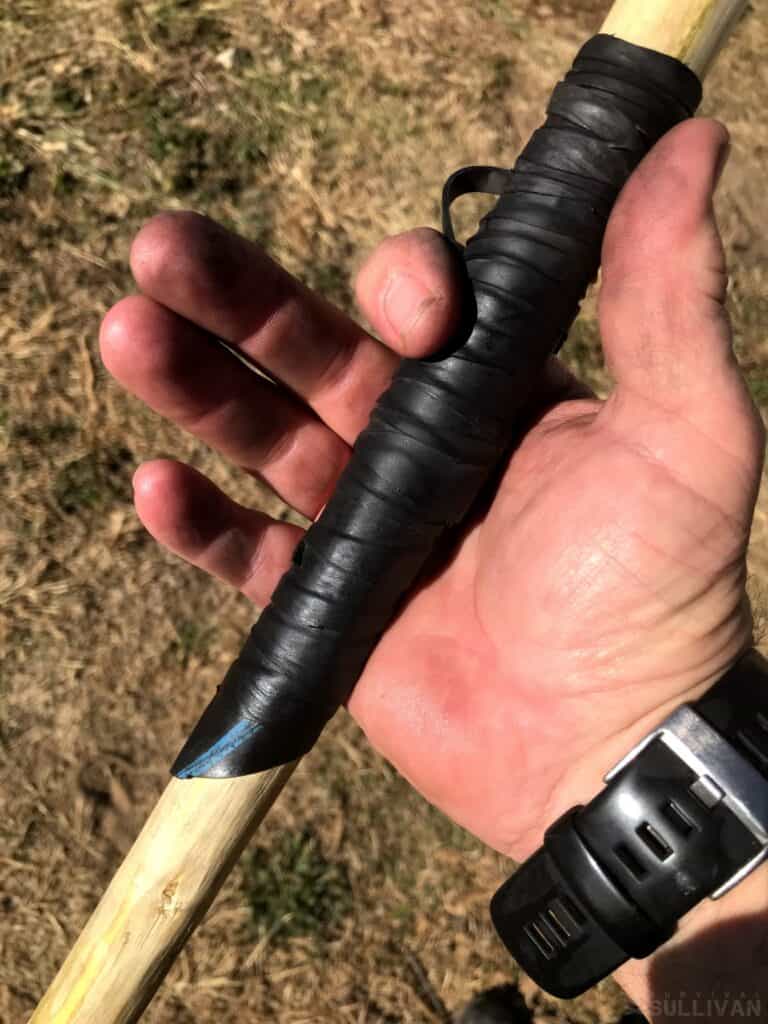 holding the spear leather grip in hand