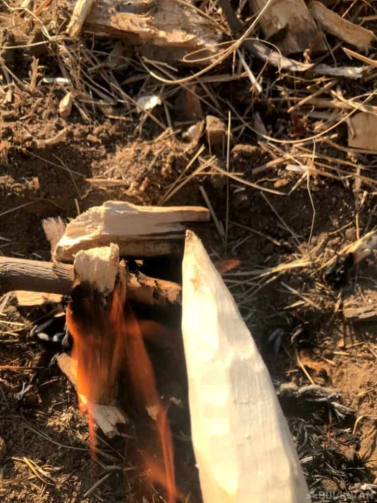 small fire next to spear tip