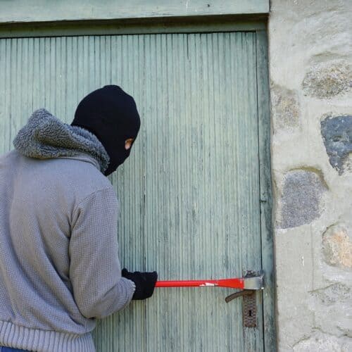 thief breaking a door