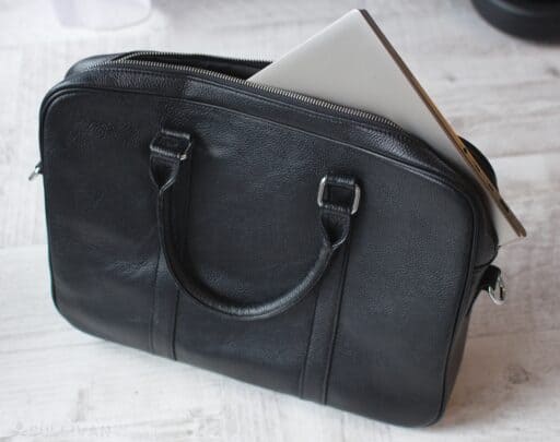 laptop inside black leather laptop bag