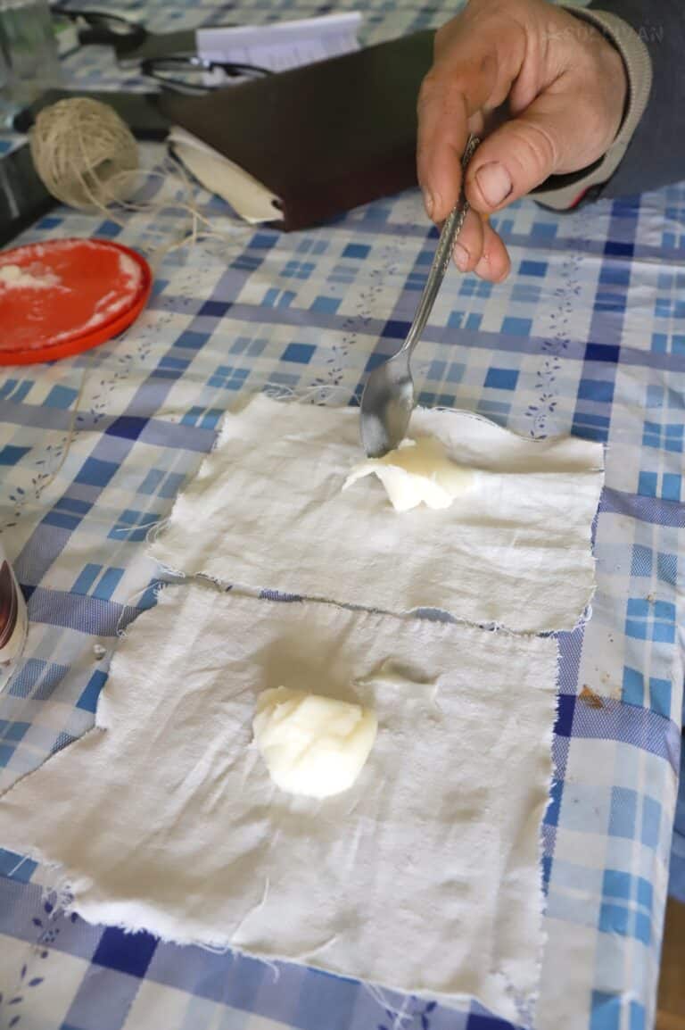 making tallow balls wrapped in pieces of cotton