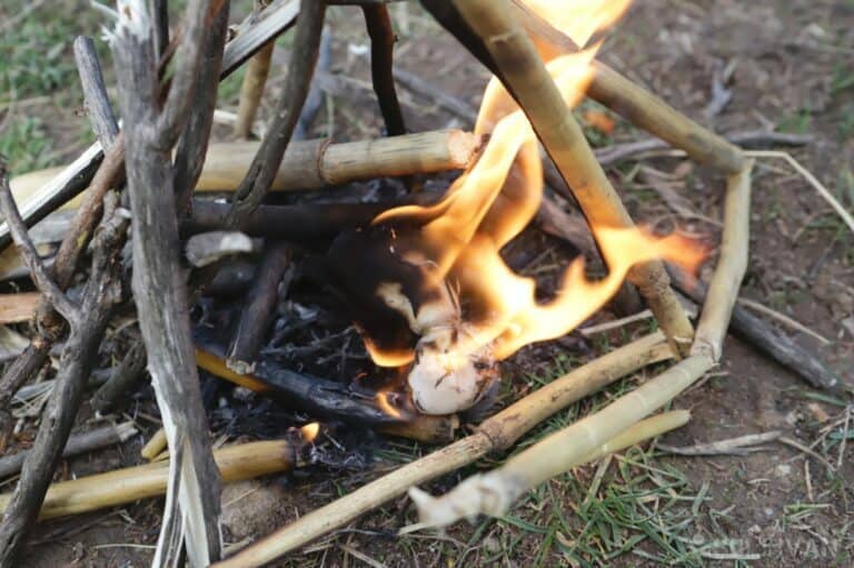 tallow ball burning to sustain outdoor fire