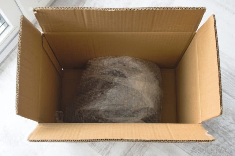 electronics wrapped in bubble wrap inside carboard box