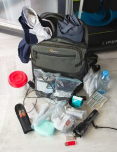 go bag backpack with clothes and survival items