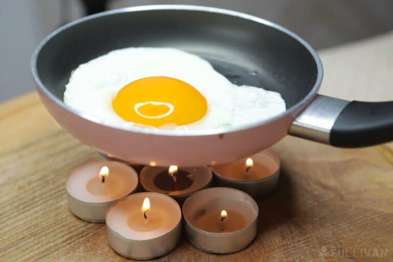 cooking an egg over tealights
