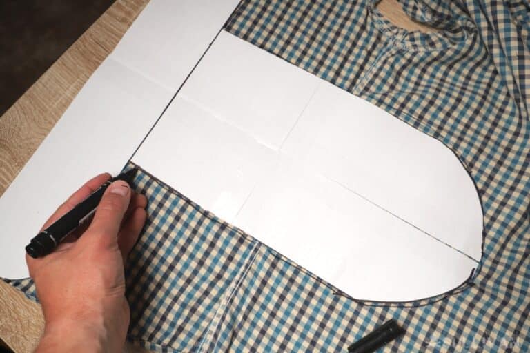 drawing the shape of the diaper on the cloth with marker