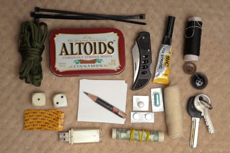 EDC items next to Altoids tin