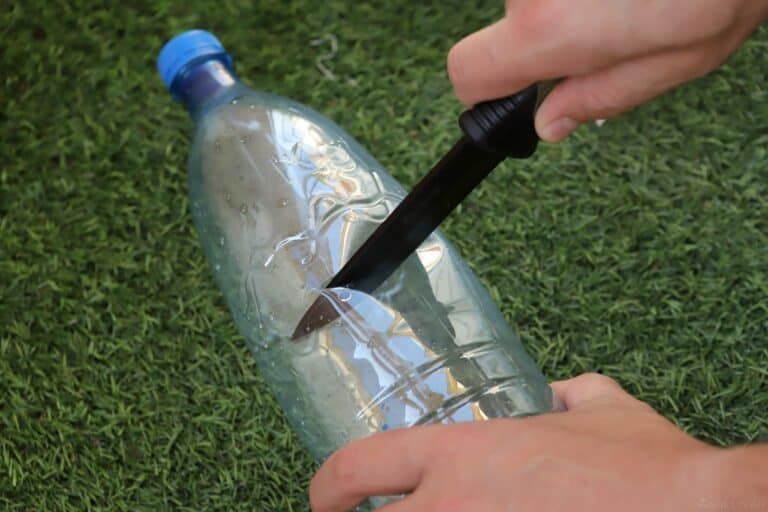 cutting plastic bottle with a knife