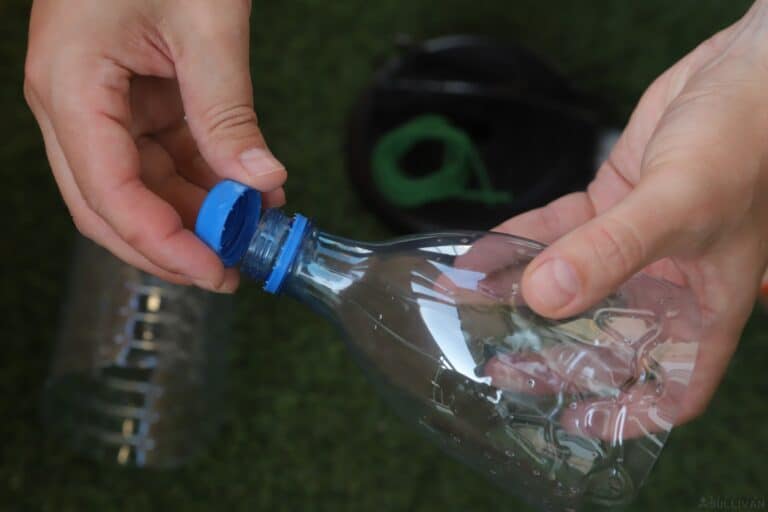 unscrewing cap from plastic bottle