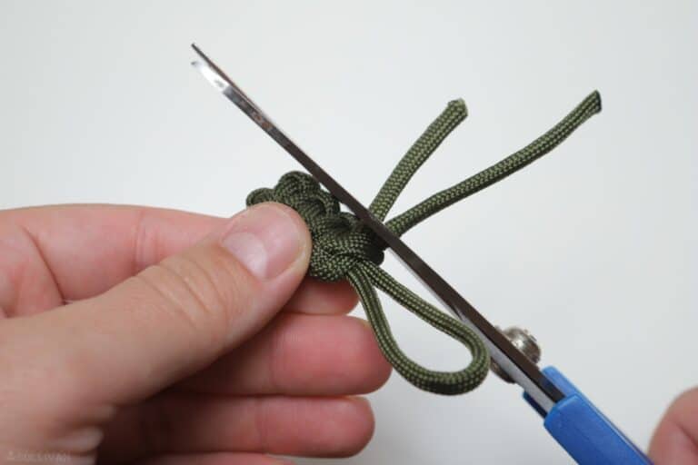 cobra knot trimming loose ends with scissors