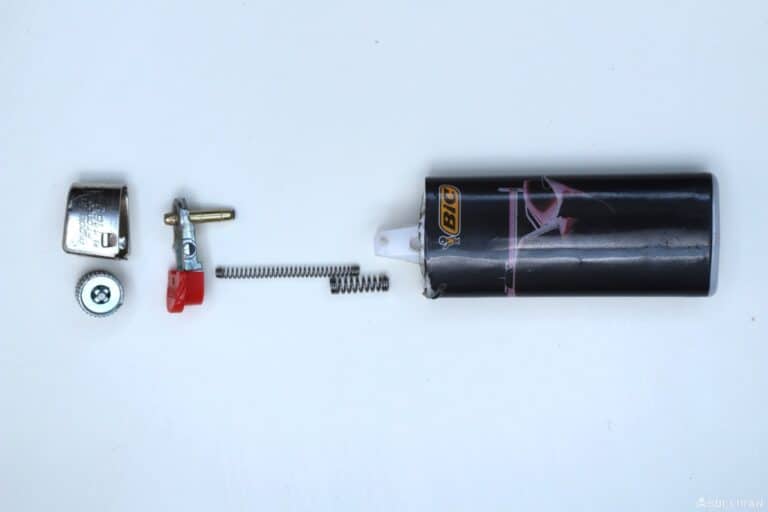 a disassembled bic lighter